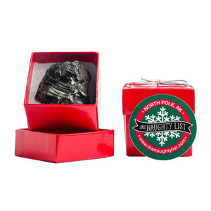 Christmas coal lump in a red ring box by The Naughty List.