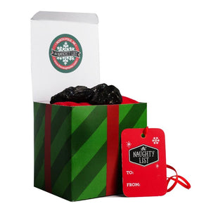 Large lump of coal in the "Mistletoe" packaging from The Naughty List